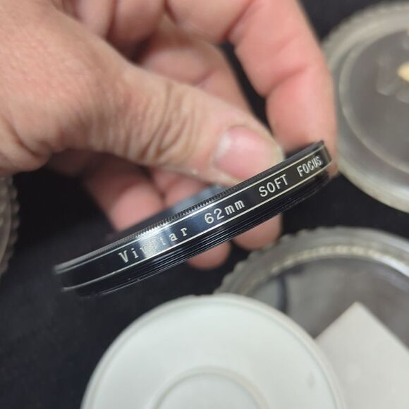 collection of camera lens filters, likely used for photography - Picture 6 of 9